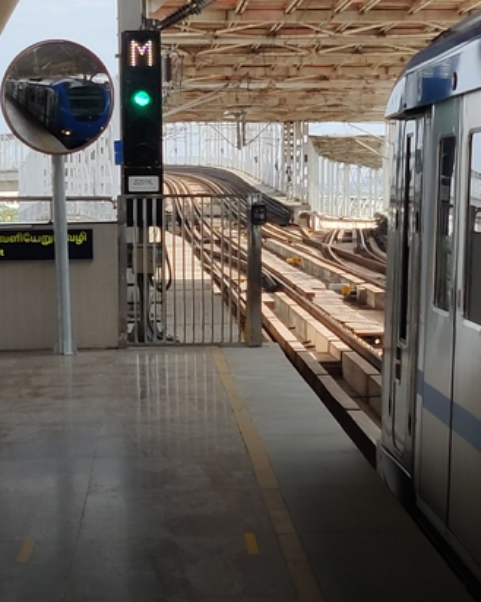 A train given clearance for departure infront of a Signal at Alandur station